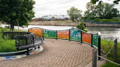 view of art and benches along the river